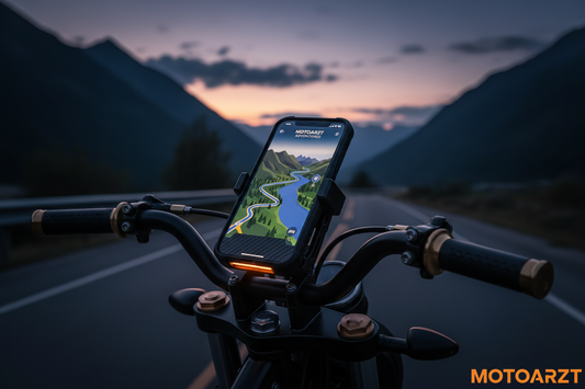 Best motorcycle phone mounts 2026 - smartphone securely mounted on motorcycle handlebars displaying GPS navigation on scenic road