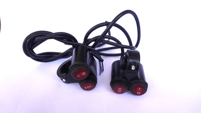 Three motorcycle turn signals with red lights and black cables on a white background