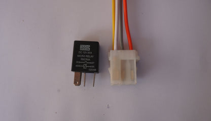 Relay with wiring connector on a plain background