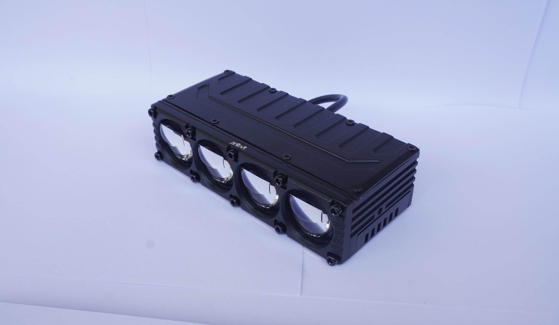 Black rectangular cooling unit with multiple vents on a light gray background