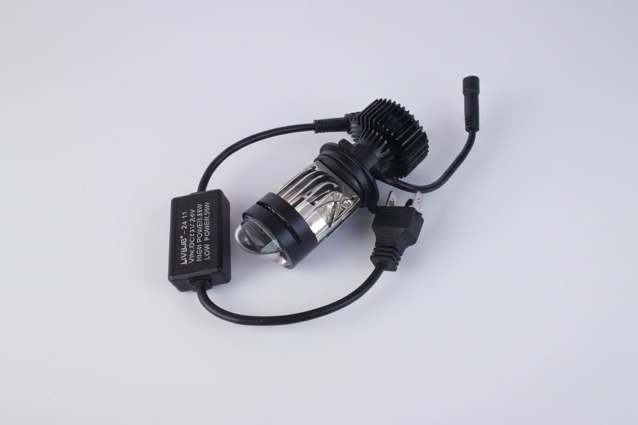 Car headlight bulb and adapter on a white background