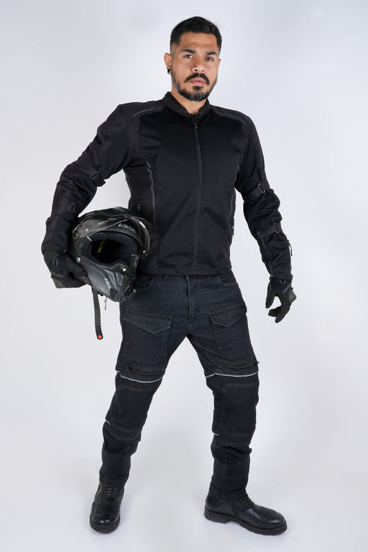 Rollin’Denims Outlaw CORE-X charcoal black riding cargo pants, front view on a standing rider, at MotoARZT.