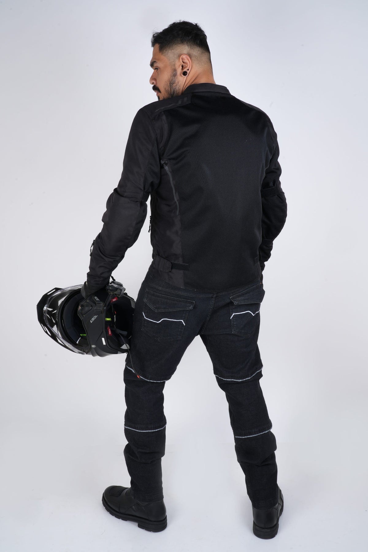 Rollin’Denims Outlaw CORE-X riding cargo pants, rear view showing pockets and reflective piping, at MotoARZT.
