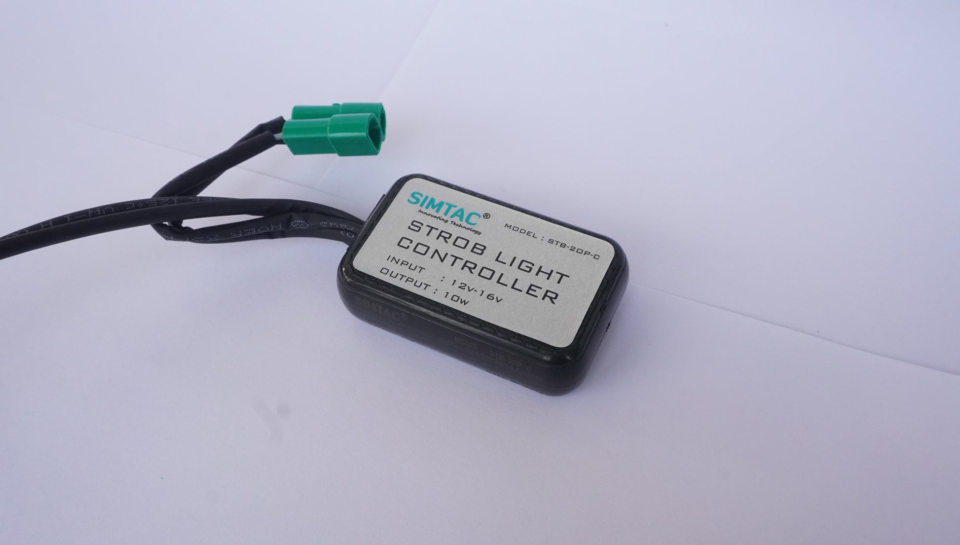 Stror light controller with wiring on a white background
