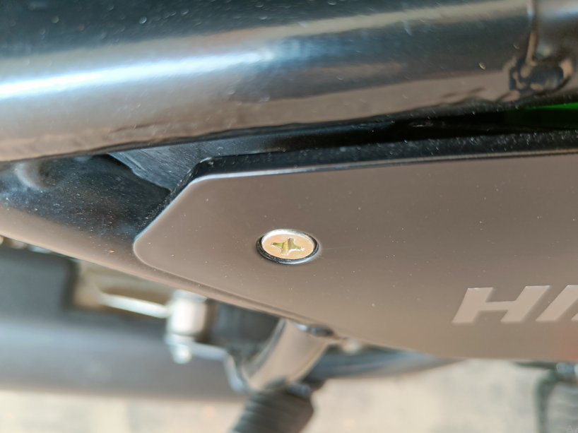 Close-up of countersunk screw flush with Himalayan 411 panel surface